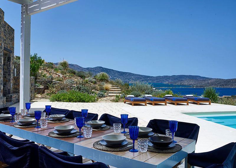 Outdoor dining area with seaview at a luxury villa in Elounda, Crete