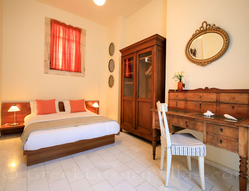 A bedroom of the exclusive historic villa in a traditional village of Crete