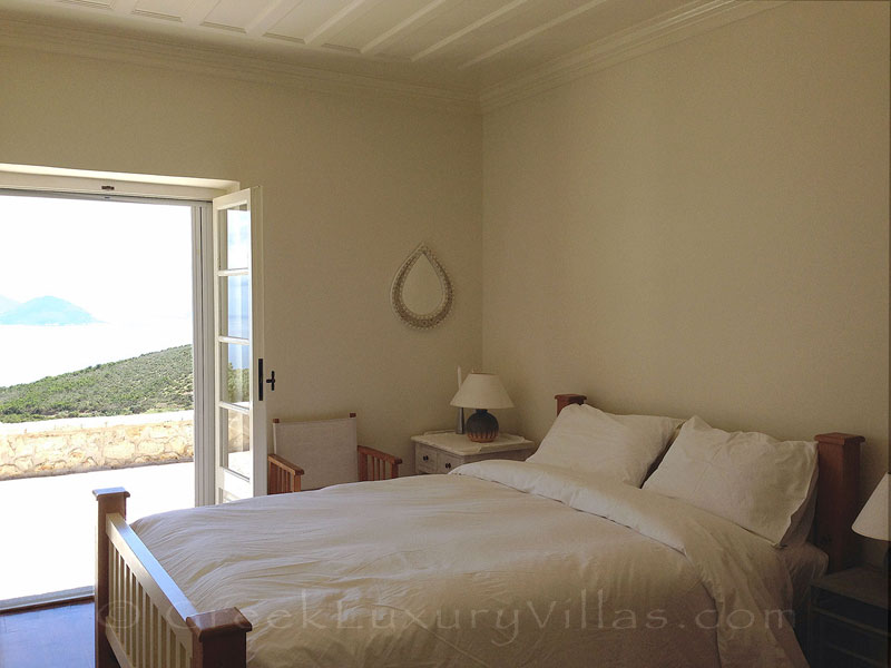 Bedroom of traditional villa with stunning garden views and pool on Lefkas