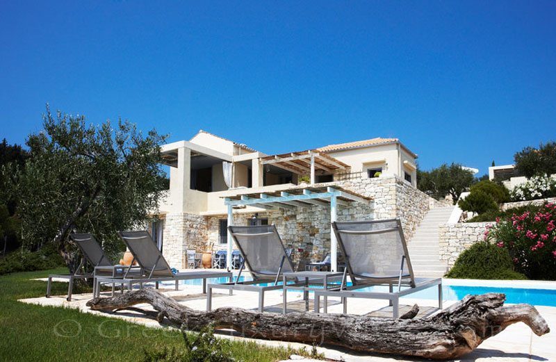 A beachfront villa with a pool in Paxos