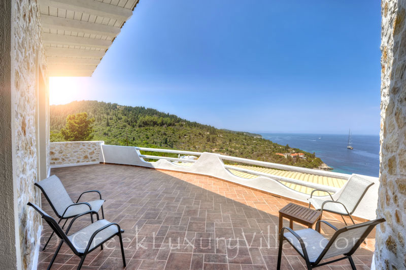A balcony of the villa with a pool and seaview in Paxos