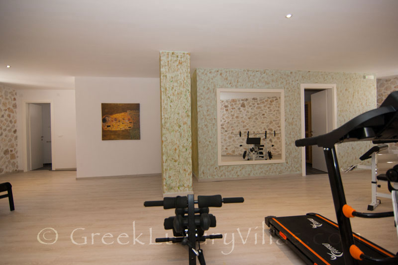The gym and sauna in a luxury villa with a pool in Paxos