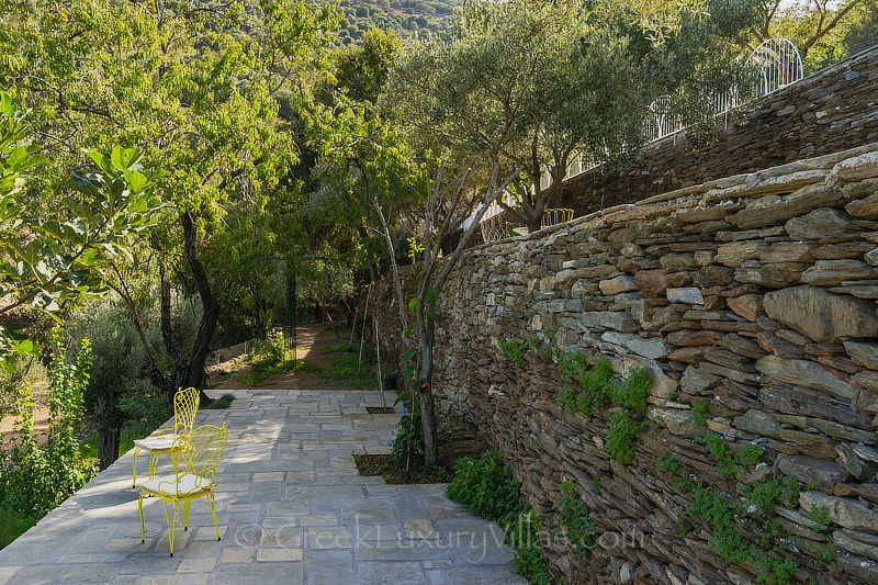 spacious garden of traditional stone villa on Andros