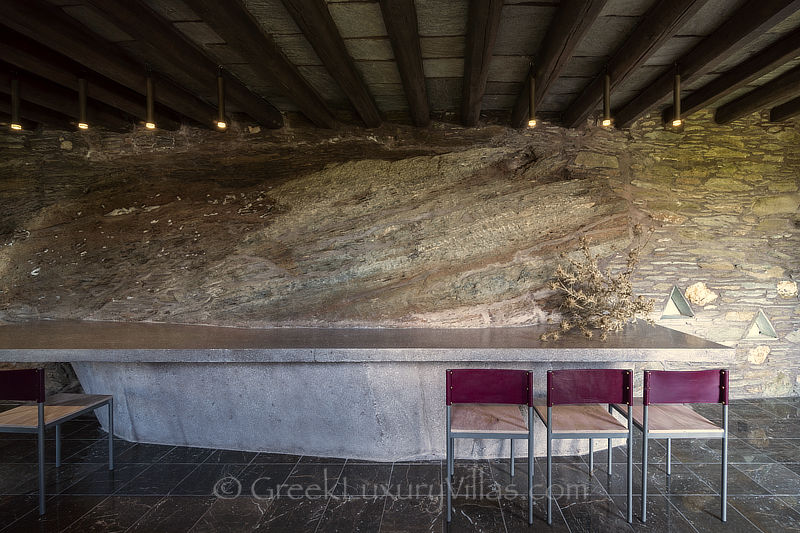 stone villa interior concrete table against rock