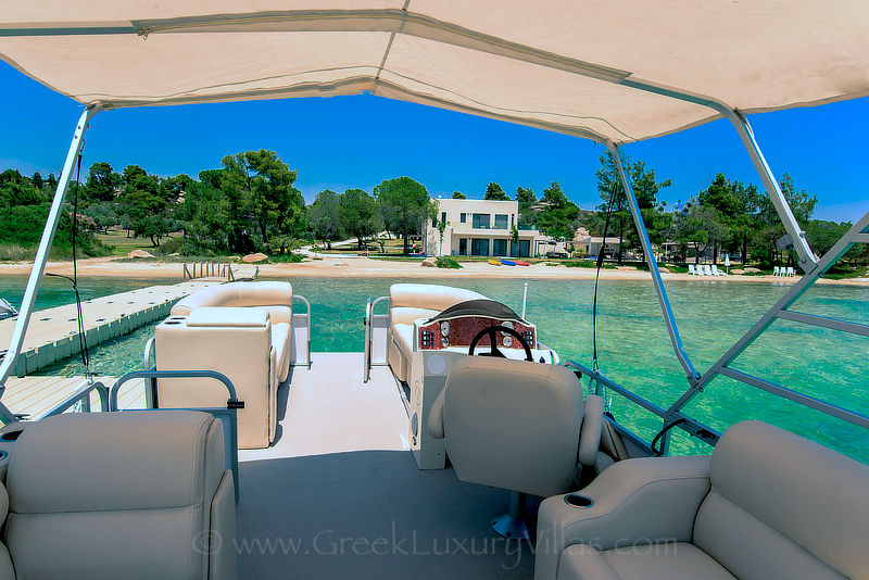 modern beachfront villa boat jetty