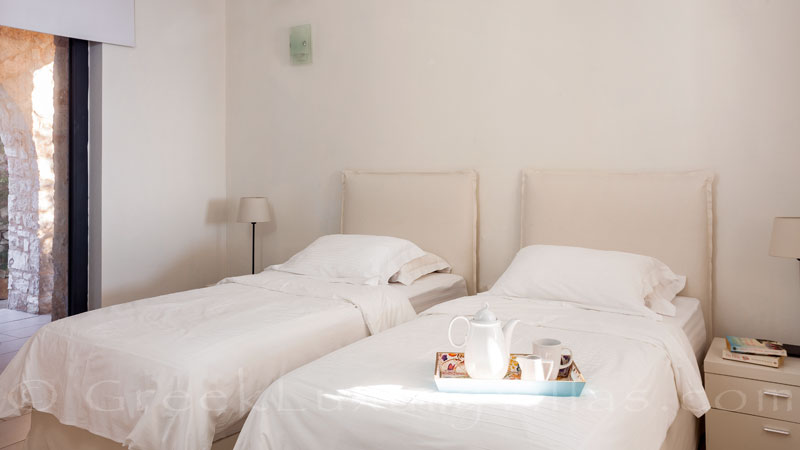 Bright bedroom with veranda access at a luxury villa in Corfu