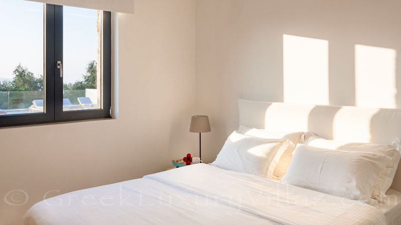 Bright bedroom on the ground floor of a luxury villa in Corfu