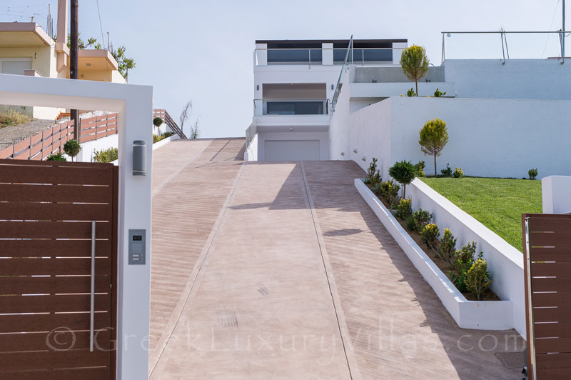 entrance modern villa with private tennis court and pool