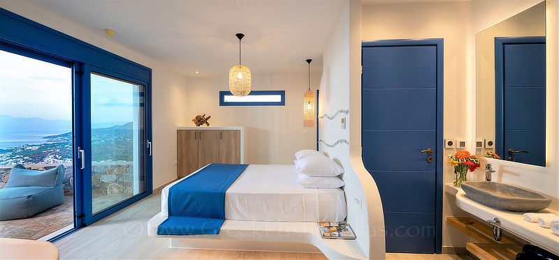 spacious bedroom with en-suite bath at luxury villa in Crete