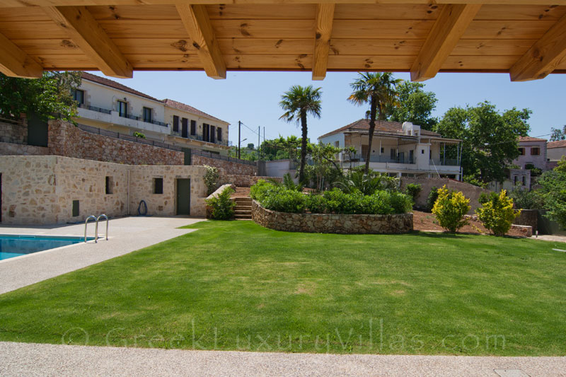 The garden of a luxury villa with a pool in a traditional village