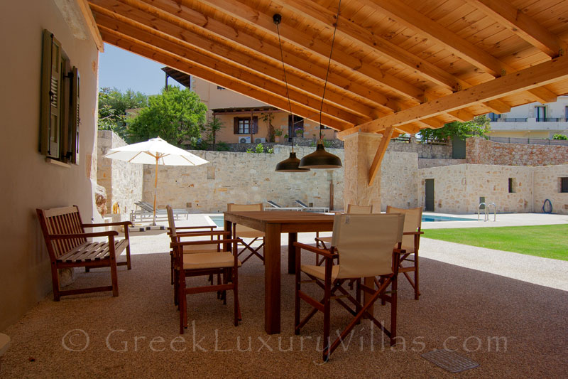 The dining at a luxury villa with a pool in a traditional village