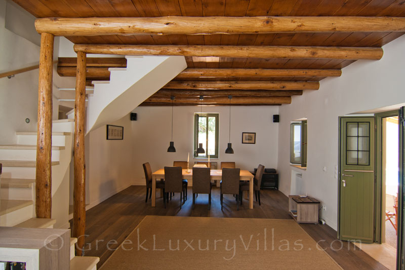 The dining-room of a luxury villa with a pool in a traditional village