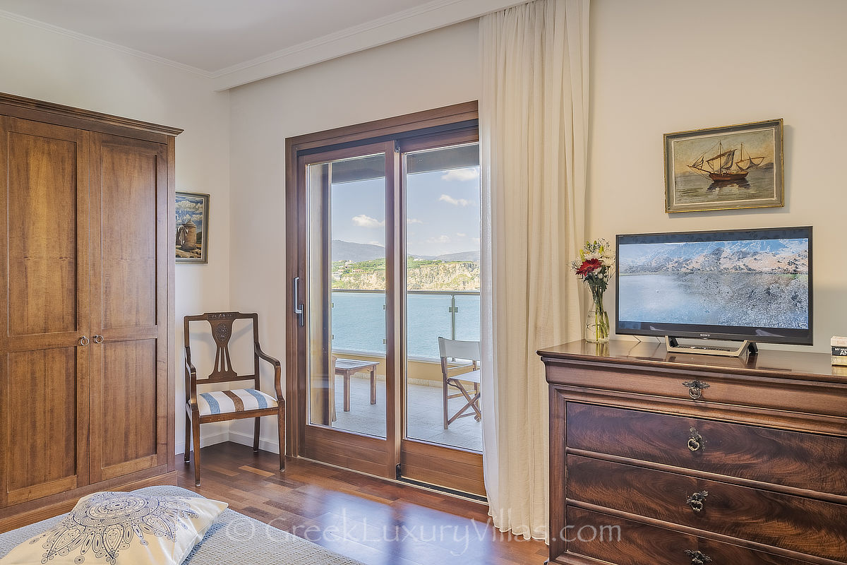 master bedroom of traditional seafront villa in Crete