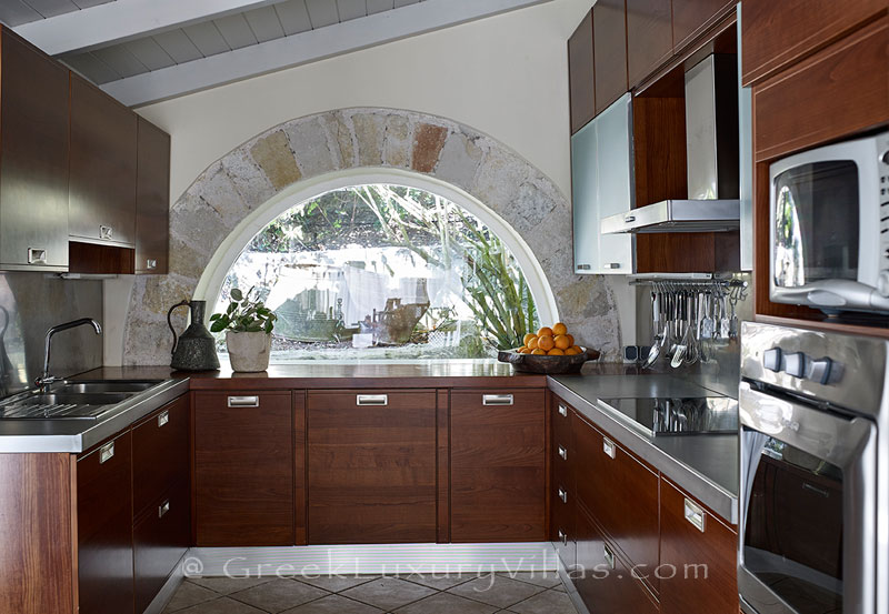 The kitchen of a luxury villa with a heated pool in Sivota