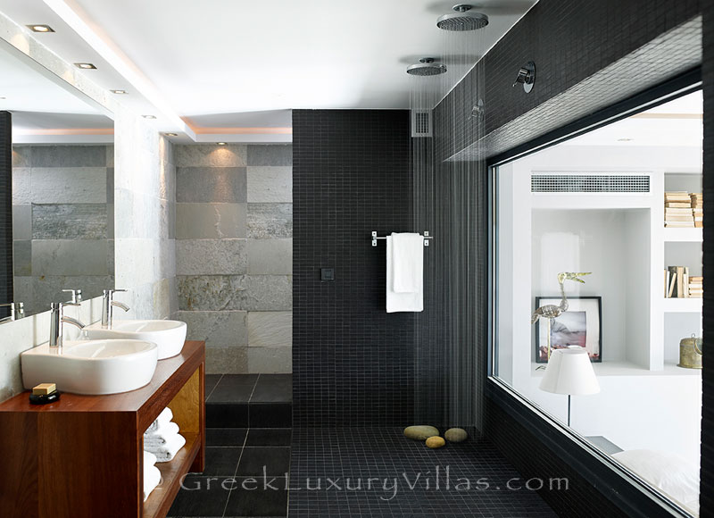 The rain shower in a bathroom of a luxury villa with a heated pool in Sivota