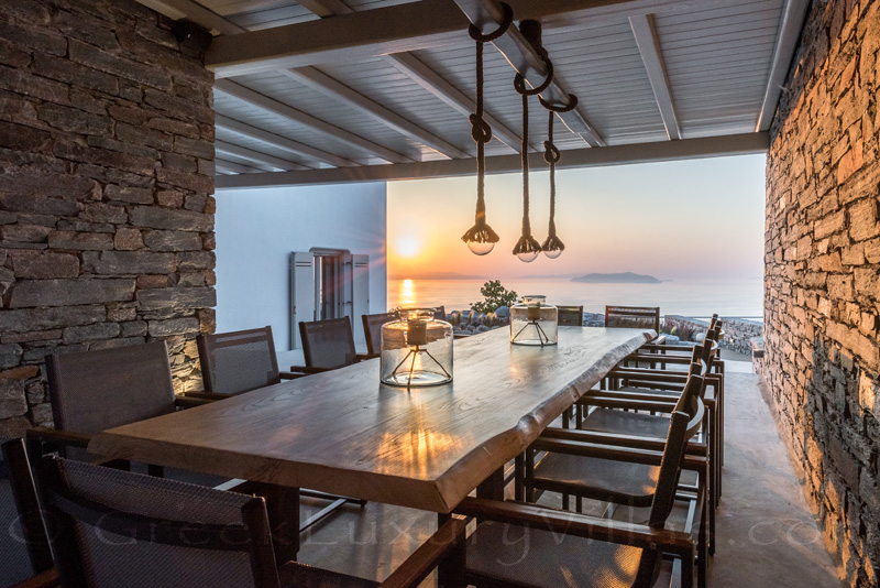 Dining with sunset view at luxury villa in Greece
