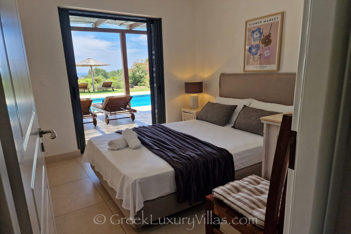 double bedroom of villa with pool by the beach