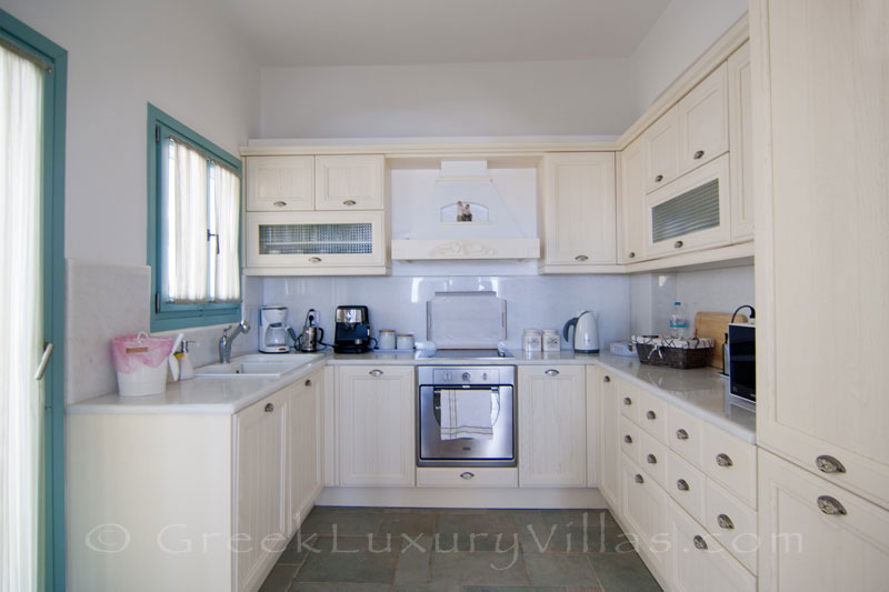 Fully equipped kitchen of luxury villa with pool on Koufonisi