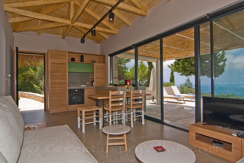 Open plan kitchen in villa with pool and seaview