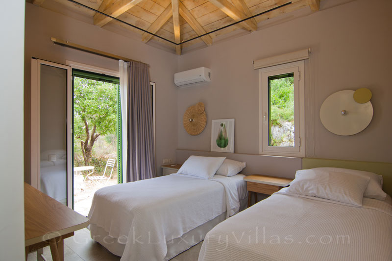Bedroom with two single beds in modern villa on Lefkas