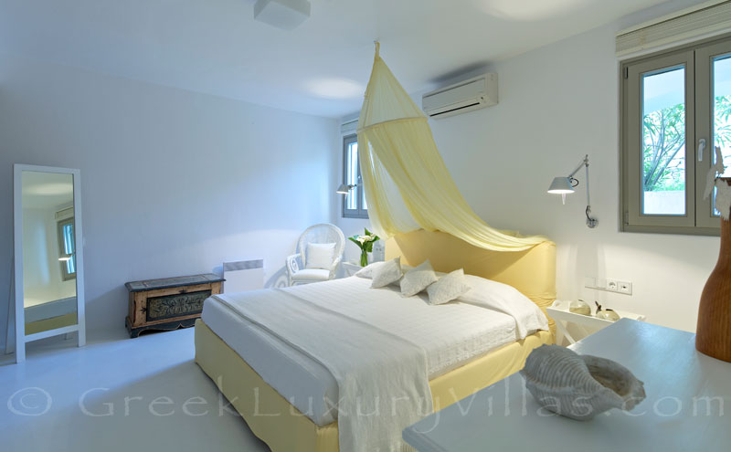 Mykonos Kalafatis-Beach luxury villa yellow bedroom