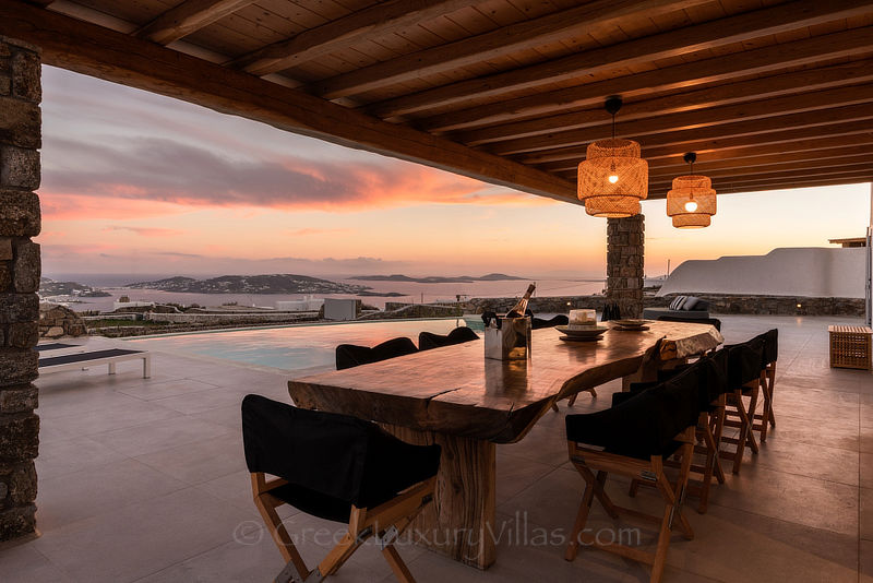 Sunset view from villa with pool at Agios Stefanos Beach