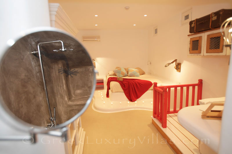 The bedroom downstairs of a luxury villa with a pool in Naxos
