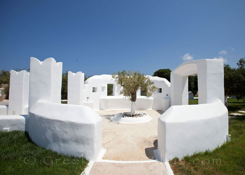 A picturesque garden of a luxury villa with a pool in Naxos