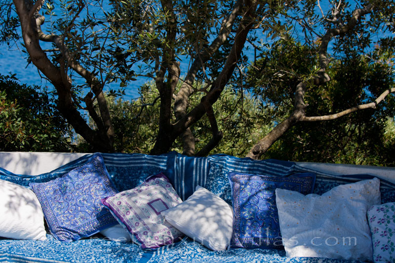 The terrace of a bedroom by the sea at a beachfront villa in Paxos