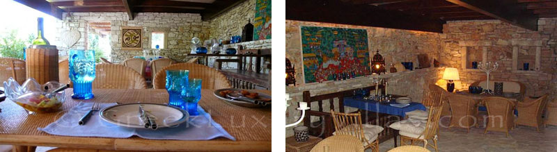 The enclosed dining area of a beachfront villa in Paxos