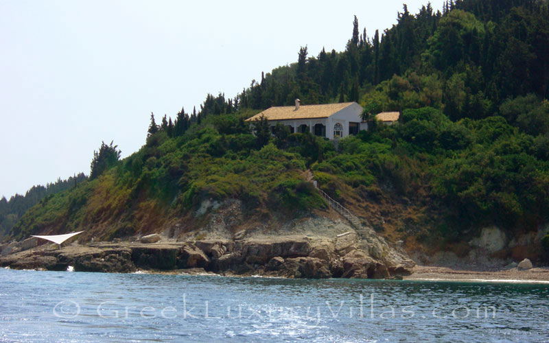 A seafront villa with a beach in Paxos