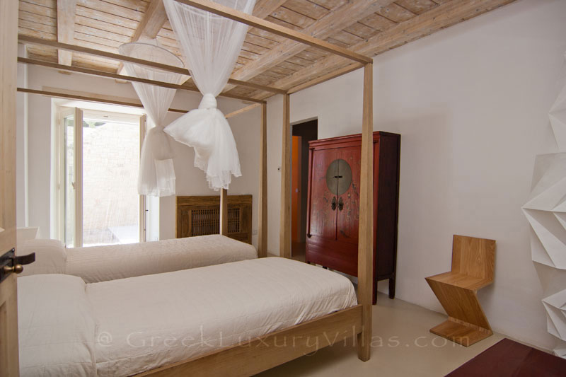 A bedroom of a hiltop estate in Paxos