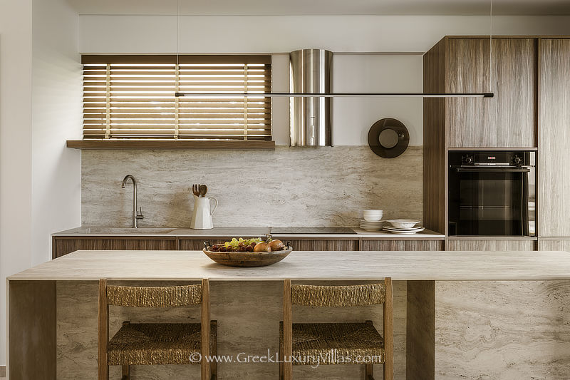 Kitchen of modern beachfront villa with pool