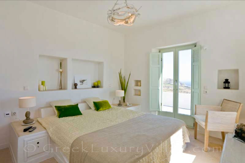 A double bedroom with seaview in the Black Rock luxury villa in Santorini