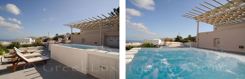 A rooftop terrace with a whirlpool bath at a luxury villa in Imerovigli, Santorini