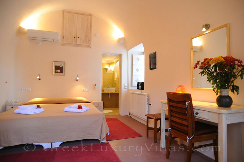 A luxury double bedroom of a villa in Imerovigli, Santorini