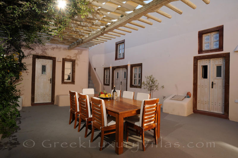 Outdoor dining area with privacy in a luxury villa in Imerovigli, Santorini