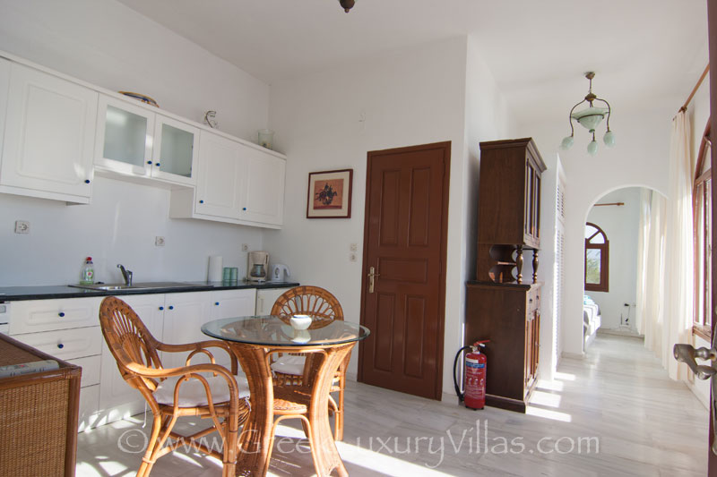 The kitchen of a large villa with a pool on the cliff in Santorini