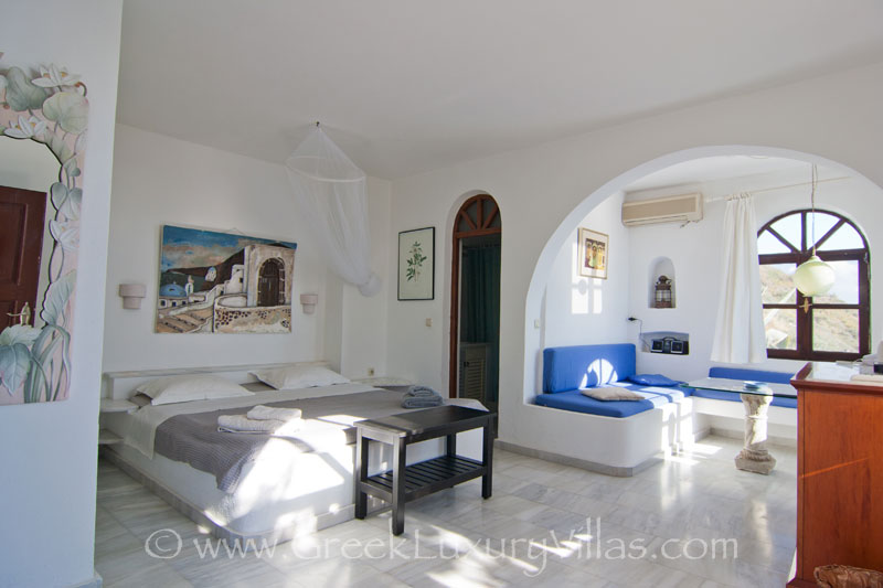 En-suite bedroom in a large villa with a pool in Santorini