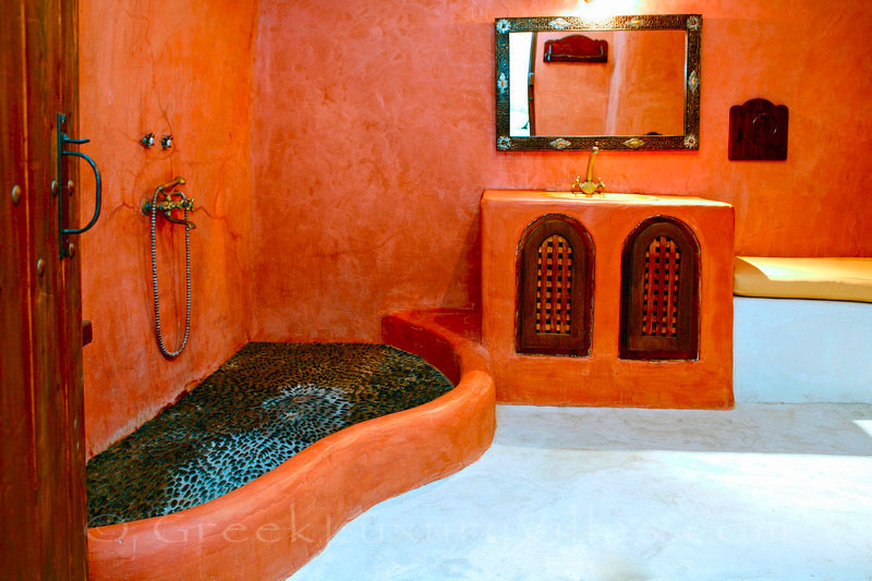 A stylish large bathroom in a stone house villa for two in Santorini