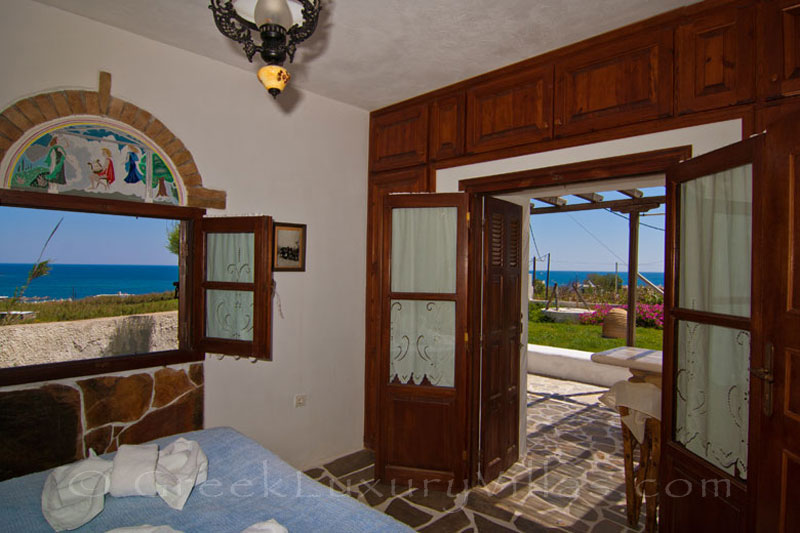 The sea view from the bedroom of a windmill with a garden near the beach in Skyros