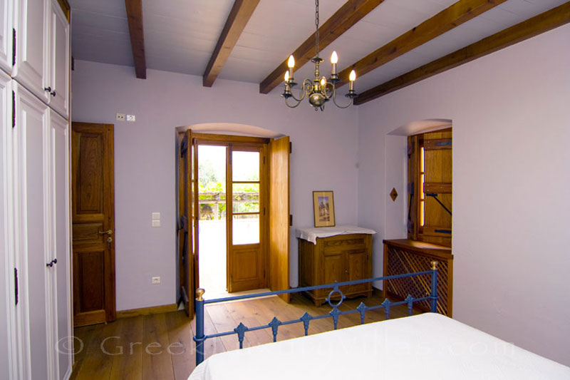 A bedroom of Ambelos apartment in a traditional villa in Spetses