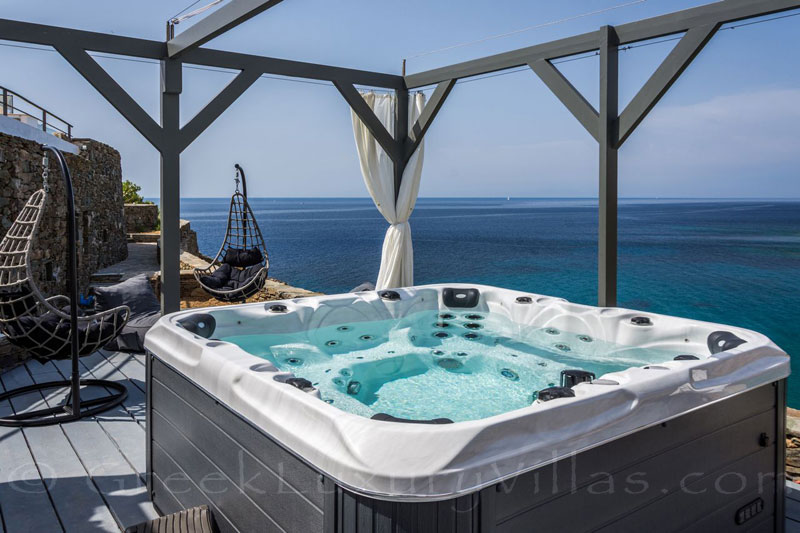 outdoor jacuzzi at seafront villa on greek island