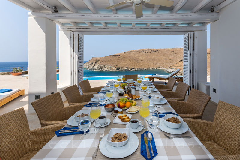 outdoor breakfast table with sea view on greek island