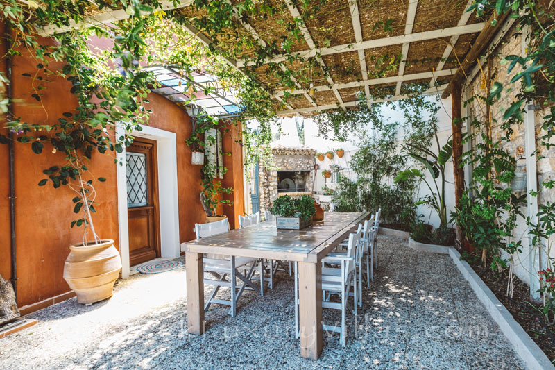A private villa with a pool and outdoor dining in Zakynthos
